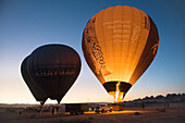 Balloon inflating, Hot air balloon flight over Hegra site and around with Hero Balloon Flights Saudi Operator, AlUla, Medina Province, Saudi Arabia