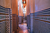 Walls decorated in mosaic in an empty Souk of Fes, Morocco
