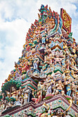 Intricate Hindu art and deity carvings on the facade of Sri Veeramakaliamman Temple in Little India, Singapore