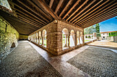 Codalet, France, Aug 22 2022, Explore the serene Romanesque cloister at Saint-Michel de Cuxa in Codalet, France, featuring elegant arches and a tranquil courtyard.