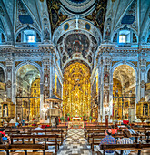 Seville, Spain, May 15 2022, Elegant interior of Baroque style church featuring a golden altar, Seville architecture.