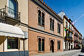 Architect Antonio Arevalo designed this neomudéjar structure in 1910, showcasing unique brickwork in Seville, Andalusia's vibrant streets.