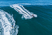 Aerial drone view of Big wave surfing in Praia do Norte (North Beach), listed on the Guinness World Records for the biggest waves ever surfed, formed under the influence of the Nazare Canyon, Portugal