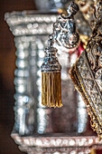 Close-up view of the intricate silver craftsmanship on the handgrip of the paso de palio for Virgen del Socorro in Seville.