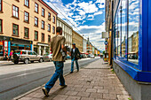 Oslo, Norway, Aug 10 2017, People walk by shops on Thorvald Meyers Street in Oslo's lively Grunerlokka during a sunny day, showcasing urban life and culture.