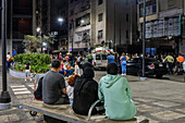 A Muslim family watches the procession of the Holy Sepulcher from the popular Pedregal neighborhood in Chacao, held every Holy Wednesday of Holy Week in Caracas. Venezuela