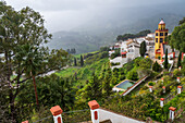 Carratraca village showcased amidst stunning greenery and iconic Andalusian architecture in Spain.