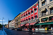 Oslo, Norway, Aug 10 2017, Vibrant buildings and bustling cafes fill Karl Johans street in Oslo, creating a lively atmosphere on a sunny day.