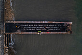 Aerial view of a poem by Alberto Caeiro, one of the heteronyms created by the Portuguese poet Fernando Pessoa, written on a dock of waterside Cais do Sodre, a buzzing nightlife and dining destination in Lisbon, Portugal