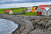 View of coastal buildings colorful houses on Vigur Island, Westfjords, Iceland