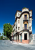 Todogoma building stands majestically at the corner of Adriano street, showcasing architectural elegance from 1926 in Seville, Andalusia.