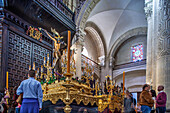 Seville, Spain, Apr 3 2009, Visitors admire the ornate floats of Cristo del Amor and La Borriquita inside the Collegiate Church of El Salvador during Holy Week.