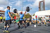 Seville, Spain, Nov 9 2024, Athletes demonstrate strength and skill during a Crossfit competition in Seville, Spain, capturing the spirit of community and competition.