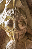 Codalet, France, Aug 22 2022, Burlesque figure carved in stone adorns a 12th-century capital, showcasing art from the cloister of Saint-Michel de Cuxa in Codalet.