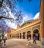 Seville, Spain, May 15 2022, Neo-Mudejar styled building with characteristic arches in Seville's historic Plaza de Armas area.