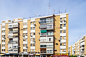 Urban architecture showcasing residential buildings in the historic Triana district of Seville.