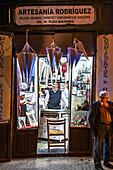 Seville, Spain, March 20 2009, A workshop in Seville prepares nazareno robes and capirotes for Holy Week, showcasing rich traditions and meticulous craftsmanship.