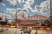 Seville, Spain, Apr 29 2009, Horse-drawn carriages glide through the vibrant Seville Fairgrounds during the lively April's Fair, captured in beautiful long exposure.