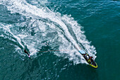 Aerial drone view of Big wave surfing in Praia do Norte (North Beach), listed on the Guinness World Records for the biggest waves ever surfed, formed under the influence of the Nazare Canyon, Portugal