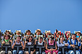 Seville, Spain, Apr 29 2009, Thrilling moments as young riders scream while enjoying dizzying spins at April's Fair in Seville, Andalusia, under a clear blue sky.