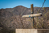 A handmade wooden cross in the desert