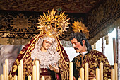 Seville, Spain, Apr 11 2017, Virgin of the Greatest Sorrow and Piercing (1798, by an anonymous author) and Saint John the Evangelist (1620, a work by Juan de Mesa), in the canopy float of the Brotherhood of Gran Poder.