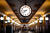 Central clock and station interior at Prado de San Sebastian bus station in Seville