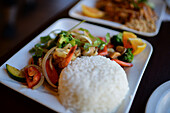 Dish with white rice and vegetables in restaurant