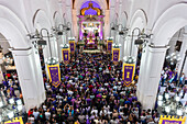 Nazarene of St. Paul. Caracas. On Holy Wednesday, hundreds of Venezuelan believers dressed in purple attend the Basilica of Santa Teresa in Caracas to venerate and pay their promises to the Nazarene of St. Paul. This Holy Week tradition dates back to the 16th century, in gratitude to San Pablo El Ermita?o for stopping the smallpox epidemic that plagued the city. Venezuela.