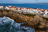Aerial view of Vestigios do Forte, the rocky cliffs of Baleal Island and local architecture, Portugal