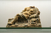 A small statuette of a woman in the Vesuvian Life Gallery, National Archaeological Museum of Naples, Naples, Italy. The lead-glazed terra cotta figure is from Pompeii, circa 1st Century A.D.