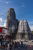 The exterior of the unusual Church of Our Lady of Chiquinquirá in El Peñol in Colombia. The tower imitates the shape of the nearby Piedra del Peñon.