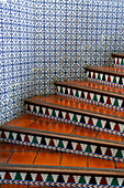 A stairway with Spanish tiles in a classic hotel in Salta, Argentina.