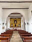 The nave and main altarpiece of the Spanish colonial La Merced Church, built in 1545, and the oldest church in Cali, Colombia.