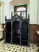 A wooden confessional in the Basilica of Our Lady of Candelaria, Medellin, Colombia.