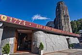 The exterior of the unusual Church of Our Lady of Chiquinquirá in El Peñol in Colombia. The tower imitates the shape of the nearby Piedra del Peñon.