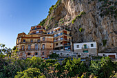 Typical architecture in the town of Amalfi on the Amalfi Coast in Italy. An historic building with a new hotel behind.