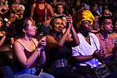 Spectators enjoying the artists' performances at the Pablo Tobón Uribe theater.