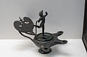 A 1st Century bronze lamp in the Vesuvian Life Gallery, National Archaeological Museum of Naples, Naples, Italy, with a statuette of a drunken Silenus.