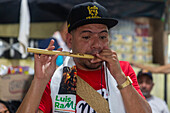Man playing millo flaute.