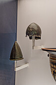 4th & 5th Century bronze helmets from Egnatia in the National Archaeological Museum of Naples, Naples, Italy. Magna Graecia Collection.
