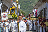 Procession of the Risen Christ, Easter Sunday. Holy Week in Santa Fe de Antioquia. The celebration of this Catholic tradition in this municipality in the department of Antioquia, Colombia, is one of the most important in the country. The processions through its old cobblestone streets are a tradition dating back to the colonial era and are accompanied by the smoke of incense and the songs and prayers of the penitents who accompany them.