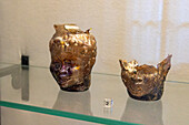 Mold-blown glass containers in the Vesuvian Life Gallery, National Archaeological Museum of Naples, Naples, Italy. Shaped like an African man's head an used to hold perfumed ointments. From 1st Century Pompeii.