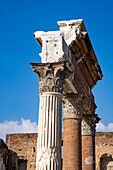 Corinthian columns in front the Macellum on the east side of the Forum in the ancient Roman ruins of Pompeii, Italy.
