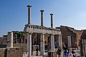 Columns along the Forum at the east end of the Basilica in the ancient Roman ruins of Pompeii, Italy.