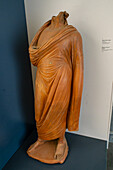 Headless terra cotta statue of a young man in a toga in the National Archaeological Museum of Naples, Naples, Italy. Magna Graecia Collection. Circa 3rd Century B.C., from Cales.