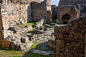 Ruins of a pastry bakery, I.4.12, in the ancient Roman ruins of Pompeii, Italy.