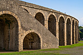 The exterior of the Amphitheater of Pompeii in the ancient Roman ruins of Pompeii in Italy.