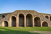 The exterior of the Amphitheater of Pompeii in the ancient Roman ruins of Pompeii in Italy.