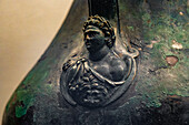 Detail of a 1st Century bronze amphora in the Vesuvian Life Gallery, National Archaeological Museum of Naples, Naples, Italy.